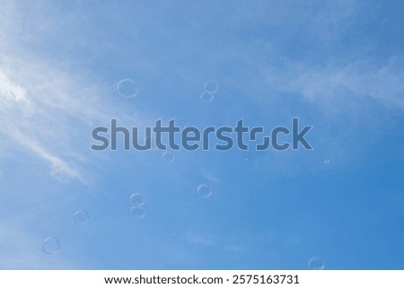 Similar – Image, Stock Photo Lots of soap bubbles in the sky