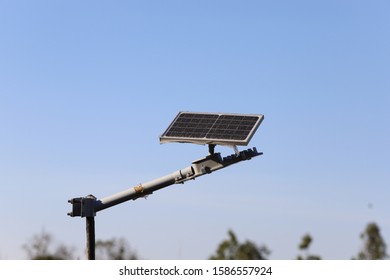 Small Solar Cell System With Lamp In The Countryside Or In The Forest Park Walkway, Natural Environment With Clean Energy Light, Selective Focused Image Of Solar Lamp In The Nature