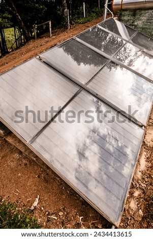 small solar heater with solar panels installed in rural areas of Brazil careless and precarious equipment 商業照片 © 