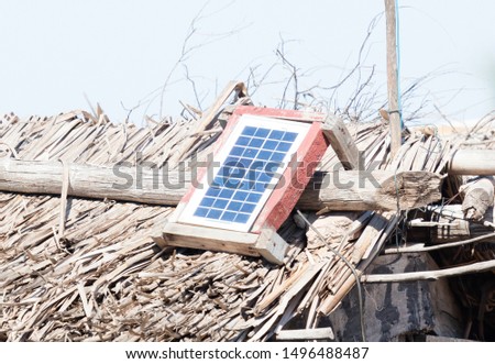 Small solar panel on a large roof in Madagascar, green energy
