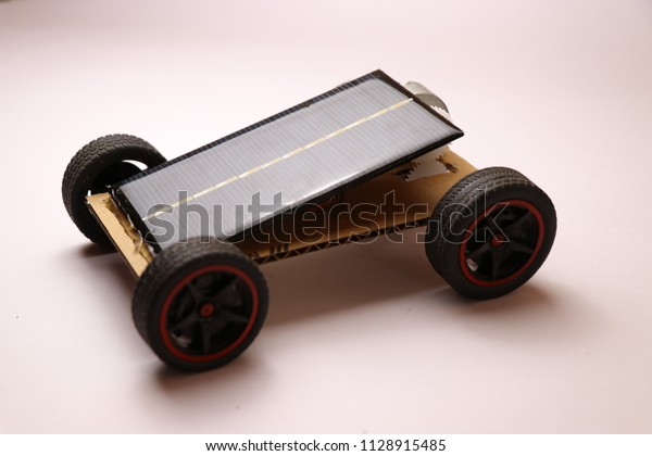 Small Solar Powered car with\
mini solar cells panel at the top.This is a home made solar powered\
car 