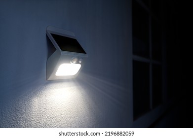 Small solar powered led light with motion sensor.	 - Shutterstock ID 2196882059