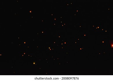 Small sparkling dots in the sky of Dieng, Central Java, Indonesia. Those dots are lanterns flown at the end of Dieng Culture Festival which is held once a year. - Shutterstock ID 2008097876