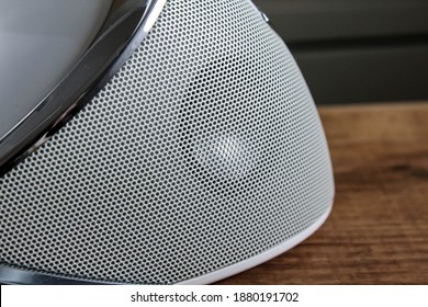 A Small Speaker In A Music Docking Station.