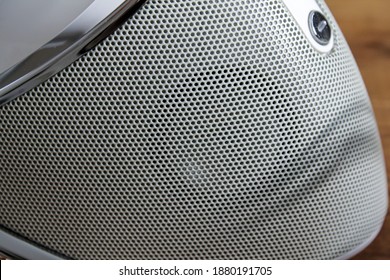 A Small Speaker In A Music Docking Station.