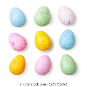 Small speckled multicolored chocolate eggs set close-up on a white background, isolated. Top view - Powered by Shutterstock