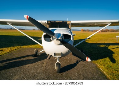 Small sport airplane Cessna 150 on standing on a runway.Single-engine turboprop airplane