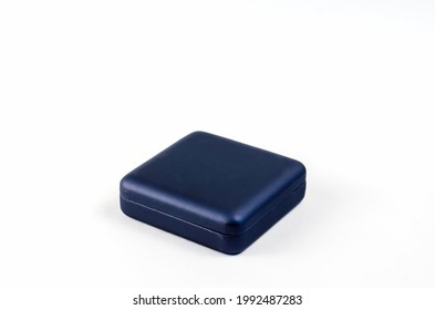 Small Square Plastic Gift Box On White Background. Closed Blue Box For Rings, Earrings, Cufflinks And Other Jewelry.