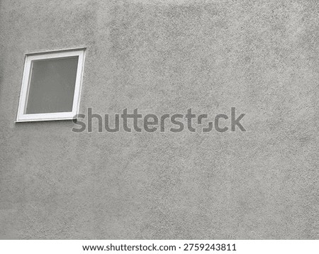 Small Square White Window Frame On Coarse Grey Cement Plastered Wall With Wide Right Copy Space