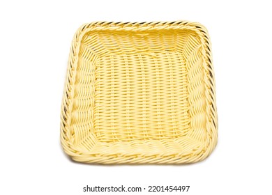 A Small Square Wicker Basket On A White Background