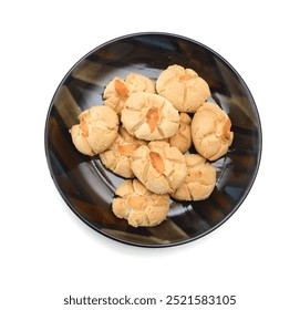 Small stack of almond nut and white chocolate cookies on white
