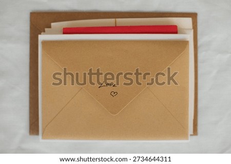A small stack of envelopes and handwritten letters