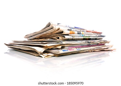 Small Stack Of International Newspapers On White Background