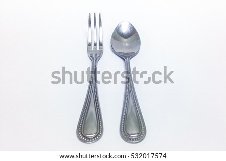 small stainless fork and spoon isolated on the white background