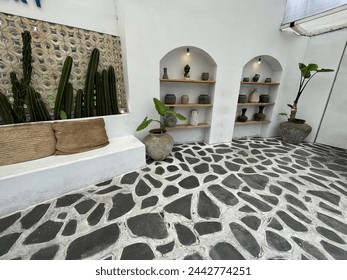 Small statue decorations for table and interior, little buddha statue modern simplistic house environment with several pottery and wooden table