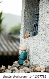 a small statue in a temple tower