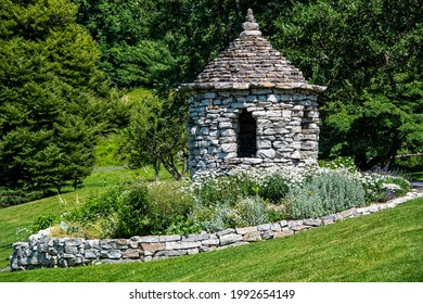 Small Stone Structured Gazebo With Flower Garden And Stone Wall, On The Grounds At Mohonk Mountain House In Upstate New York.