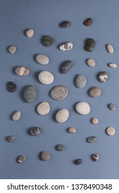 small stones for feet massage, wellness, wellbeing concepts . top view photo, fondness of nature