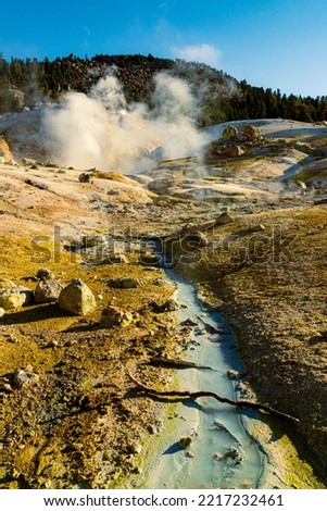 Small stream and boiling mud pot at Bumpass Hell in Lassen Volcanic National Park in northern California, USA.