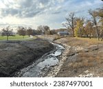 Small stream River side bend on autumn season with blue sky 