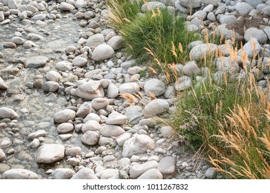 Small stream with white pebbles in mountain. 