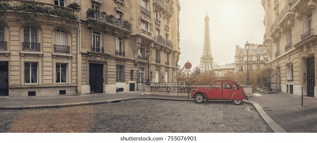 small street in paris with view on the famous Eiffel tower - panorama