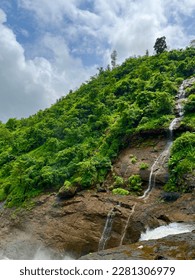 Small string from mountain of greenery 