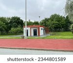 A small structure in the middle of green