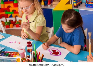 Small Students Painting In Art School Class. Child Drawing By Paints On Table. Children Study Valentine's Day In Kindergarten. Children Draw Postcards For Holiday. Kids In Prep School.