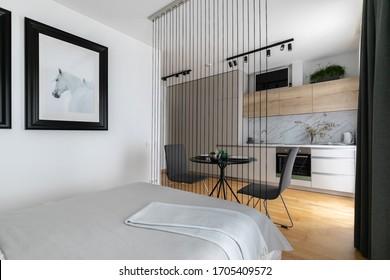 Small Studio Apartment Interior With Kitchen Area And Rope Screen