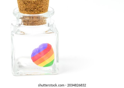 Small sweet candy in heart shape with rainbow color, heart shape sweet candy in a small cleared glass bottle, the image on white background, the concept for LGBT. - Powered by Shutterstock