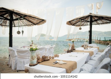 Small Tables Under Parasols Await The Lucky Guests Of This Intimate Wedding