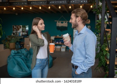 Small Talk. A Man And A Woman Chatting And Drinking Coffee