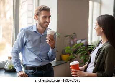 Small Talk. A Man And Woman Chatting While Having A Coffee Break