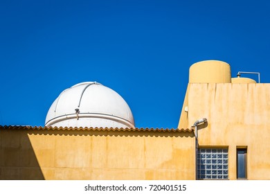 A Small Telescope Dome On A Rooftop In Spain