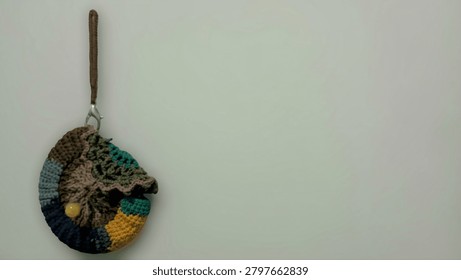 Small Textured Patchwork Yarn Bag and Wristlet Isolated on Light Background