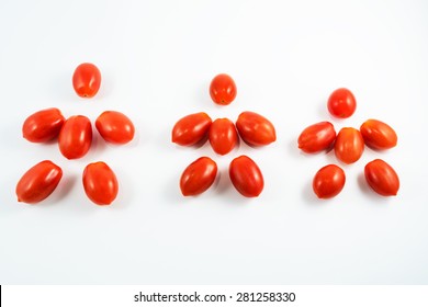 Small Tomatoes Family Isolated On White Background. Father, Mather And Kid