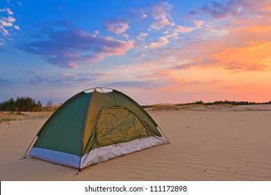 small touristic tent in a desert at the evening - Powered by Shutterstock