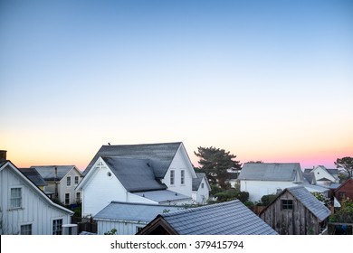 Small Town America View Of Rooftops In Early Morning Light. Copy Space