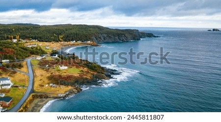 Small Town, Coast on East Coast of Atlantic Ocean. Aerial Nature Background. Sunny Blue Sky. Newfoundland, Canada.