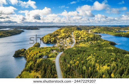 Small Town, Coast on East Coast of Atlantic Ocean. Aerial Nature Background. Sunny Blue Sky. Newfoundland, Canada.
