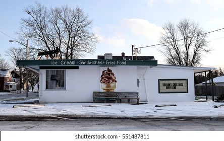 A Small Town Ice Cream Shop In Winter Closed For The Season With Ice Cream Cone Picture.