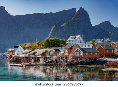 a small town in the Lofoten Islands with visible fishermen's houses, traditional rorbu