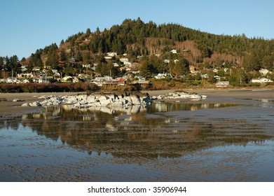 Small town reflected in low tide