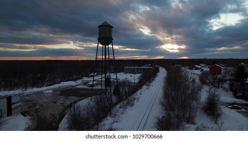 Small Town Water Tower Silhouette With Sunset