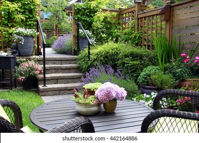 Small townhouse perennial summer garden. Also available in vertical.  - Shutterstock ID 442164886