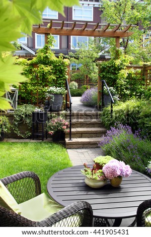 Small townhouse perennial summer garden. Also available in horizontal.