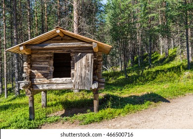 Small Traditional  Log House On Wooden Posts In Which The Sami In Lapland Save Their Food During Winter Time.