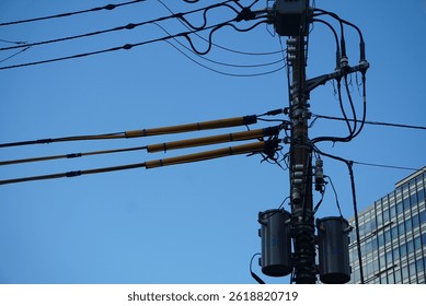 The small transformer for electricit distribution system with blue sky as the background
