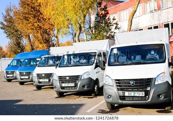 Small\
trucks, vans, courier minibuses stand in a row ready for delivery\
of goods on the terms of DAP, DDP according to the delivery terms\
of Incoterms 2010. Belarus, Minsk, August 13,\
2018.